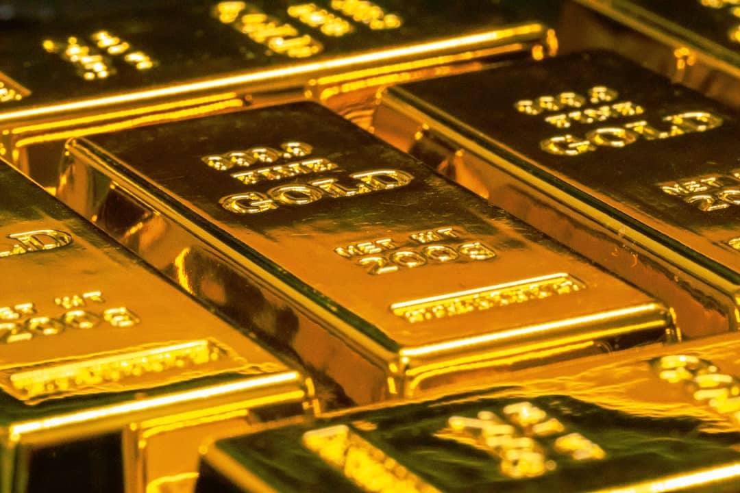 Lingotti d'oro impilati, simbolo del fixing LBMA che determina il prezzo dell'oro