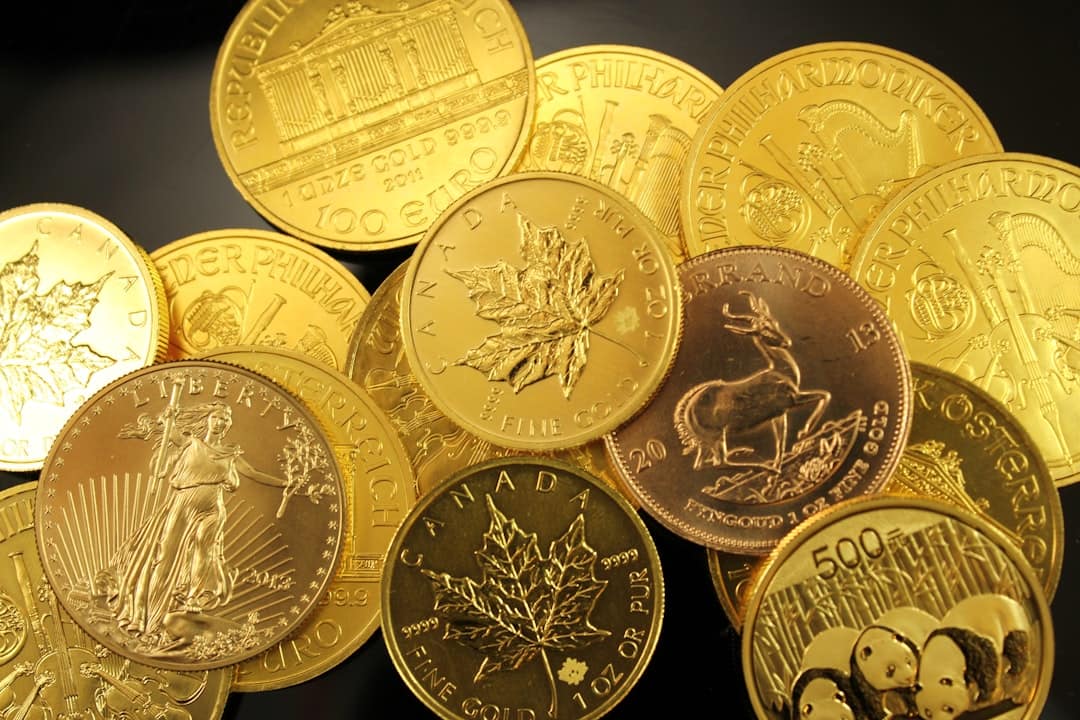 Monete d'oro da investimento, Sterlina e Krugerrand, per la vendita in un compro oro